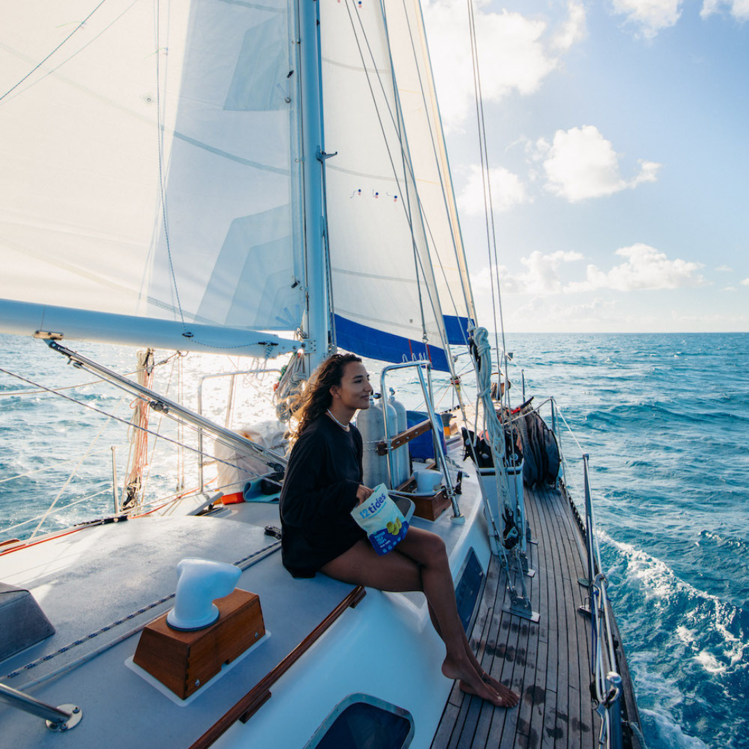 Rachel Moore sailing and snacking on sea salt puffed kelp chips